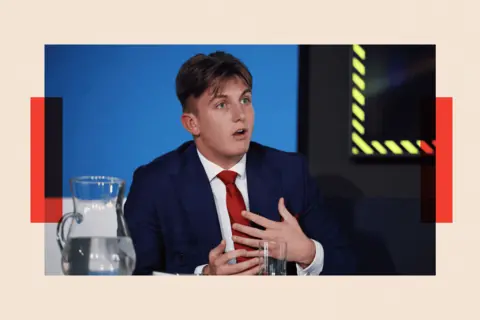 Getty Images Reform UK councillor George Finch attends a press conference