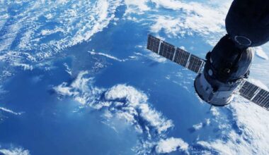 shutterstock 2291065933 space satellite in orbit above the Earth white clouds and blue sea below