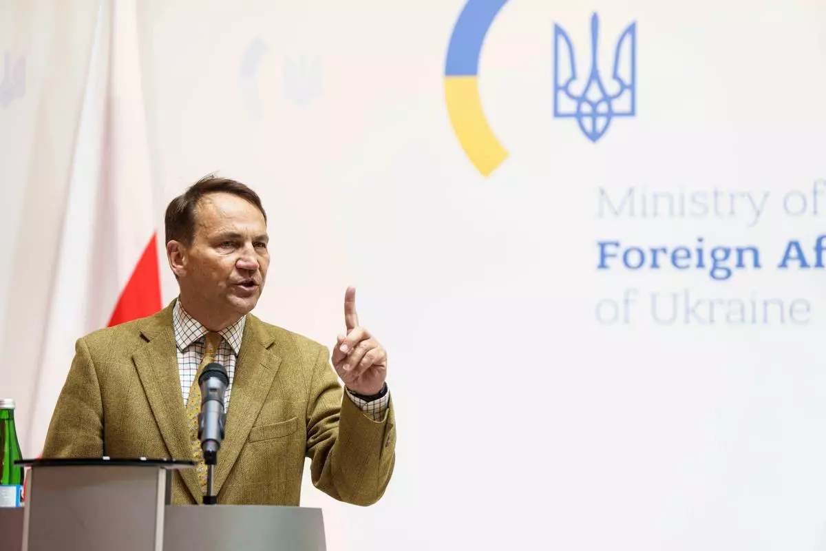 FILE - Poland's Foreign Minister Radoslaw Sikorski speaks during press conference with Ukraine's Foreign Minister Andrii Sybiha in Kyiv, Ukraine, Friday, Sept. 12, 2025. (AP Photo/Evgeniy Maloletka, file)