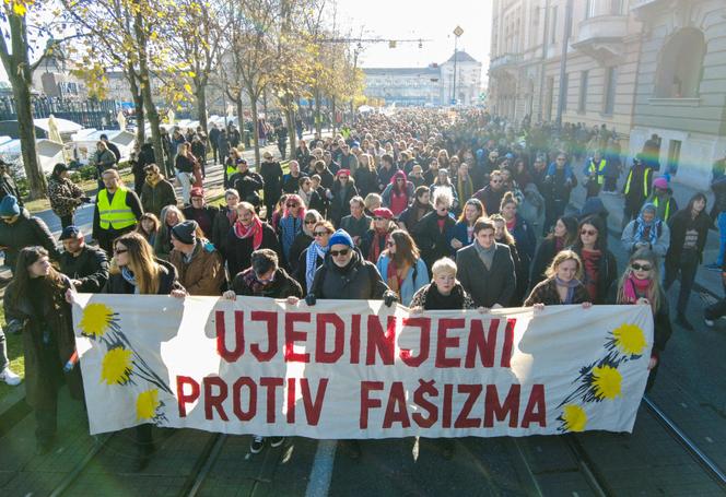 People carry a banner reading: 'United Against Fascism' during a protest against what they say is the rising use of far-right symbols and rhetoric, in Zagreb, Croatia, November 30, 2025.