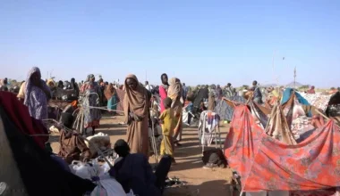 Displaced Sudanese gather and sit in makeshift tents after fleeing Al-Fashir city in Darfur, in Tawila, Sudan, October 29, 2025, in this still image taken from a Reuters' video. REUTERS/Mohamed Jamal