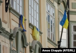 Newly installed Ukrainian flags hang from office windows within the Czech parliament building on November 7.