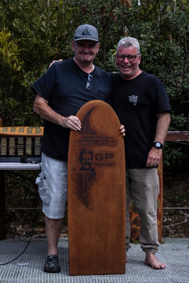 Jim O'Reilly, left, receives the Greg Perritt Memorial Award at the 2023 Coffs Soul Surfest in Coffs Harbour, Australia, September 2023.