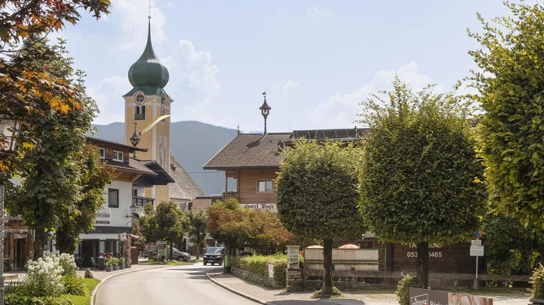 Picturesque mountain village of Westendorf, buildings, trees, and church tower