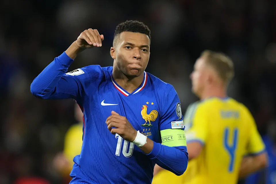 France's Kylian Mbappe celebrates the opening goal during a World Cup 2026 group D qualifying soccer match between France and Ukraine in Paris, Thursday, Nov. 13, 2025. (AP Photo/Christophe Ena)