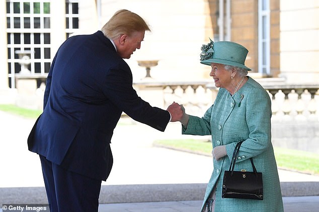 Trump is seen fist-bumping Queen Elizabeth during a trip to London in June 2019