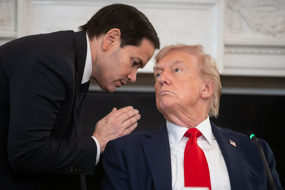 U.S. Secretary of State Marco Rubio, left, speaks with U.S. President Donald Trump during a Roundtable on Antifa in the State Dining Room of the White House in Washington, D.C., on Oct. 8. [EPA/YONHAP]