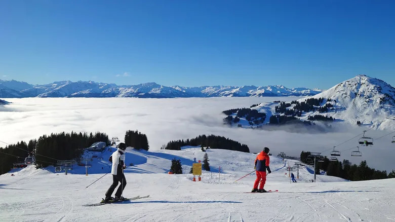 Skiers on pristine ski slopes near Westendorf