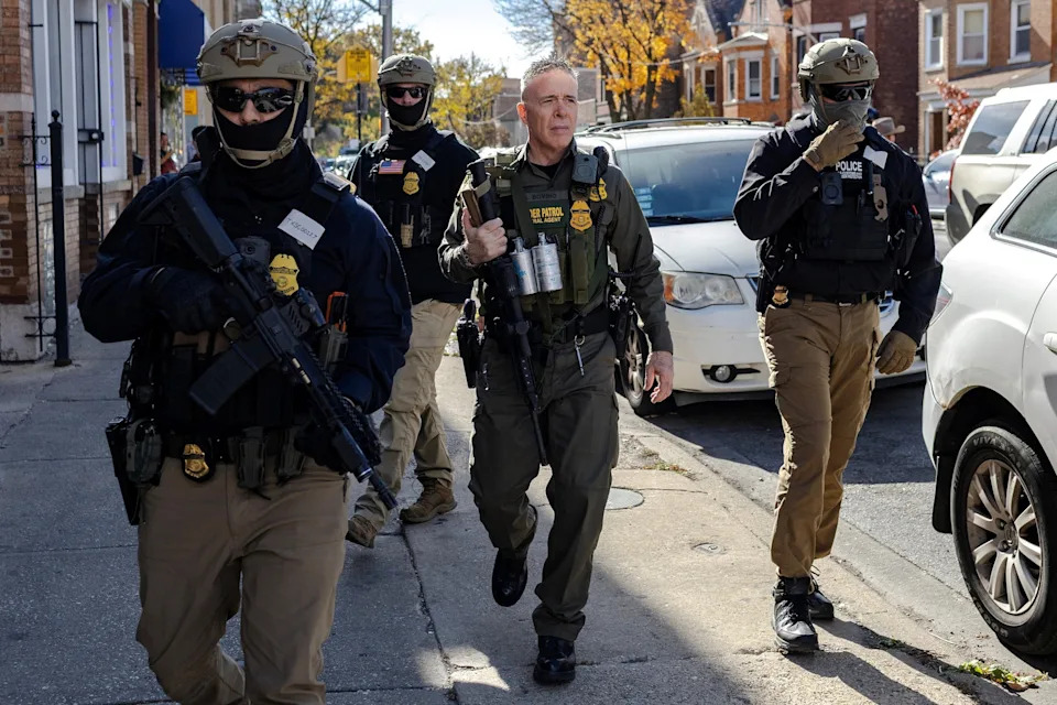 Jim Vondruska/Reuters - PHOTO: Greg Bovino, a roving Border Patrol operations commander who is leading President Donald Trump's immigration crackdown in the area and federal agents patrol the Little Village neighborhood during immigration raids in Chicago, Nov. 6, 2025.