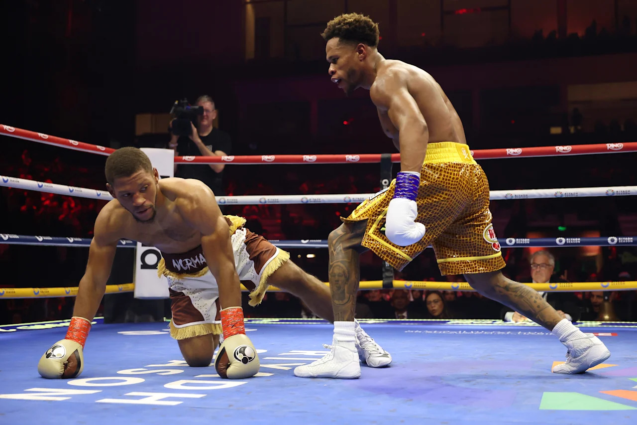 RIYADH, SAUDI ARABIA - NOVEMBER 22: (L-R) Brian Norman Jr. is knocked down by Devin Haney in a WBO world welterweight title fight during Ring IV: Night of the Champions at ANB Arena on November 22, 2025 in Riyadh, Saudi Arabia.  (Photo by Richard Pelham/Getty Images)