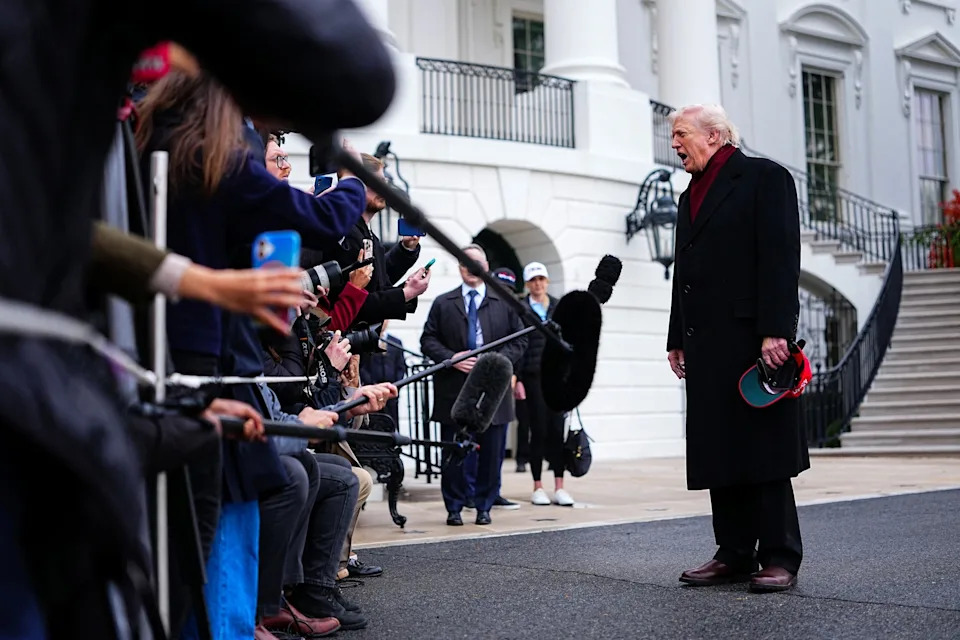 Aaron Schwartz/Reuters - PHOTO: President Donald Trump speaks to the media while on his way to board Marine One to depart for Joint Base Andrews, from the South Lawn at the White House in Washington, D.C., Nov. 22, 2025.
