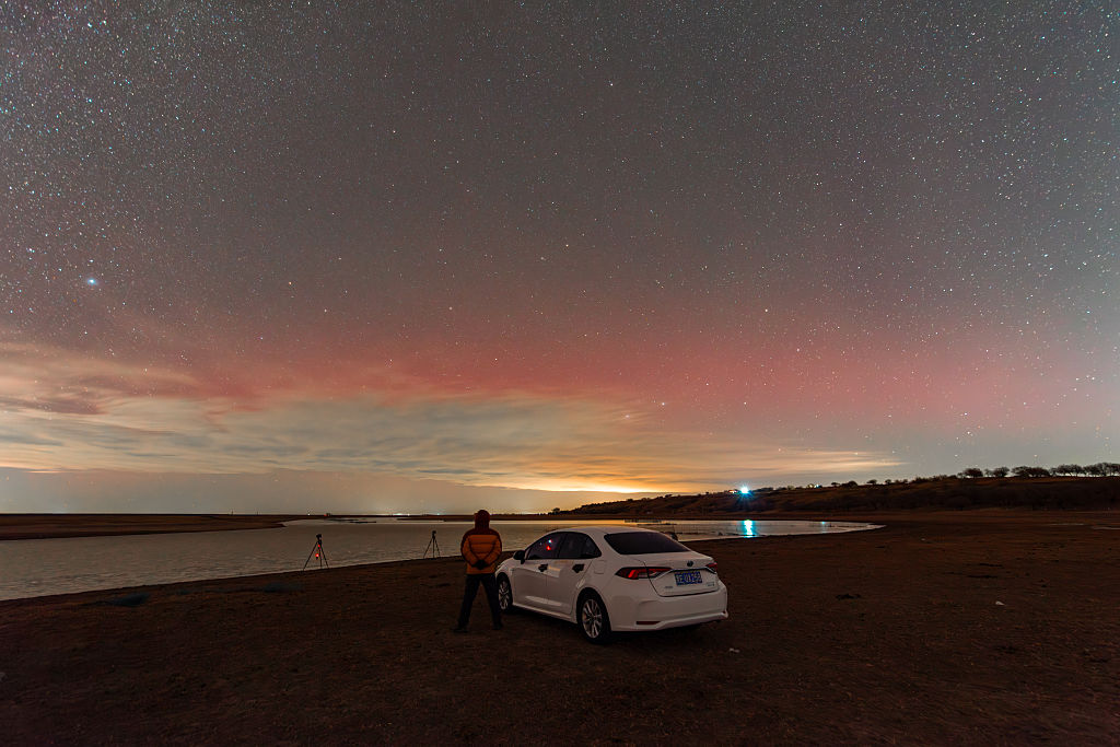 DAQING, CHINA - NOVEMBER 12: The aurora borealis, or northern lights, lights up the sky on November 12, 2025 in Daqing, Heilongjiang Province of China. (Photo by VCG/VCG via Getty Images)