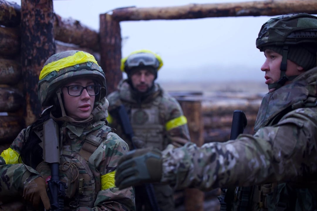 A Ukrainian instructor training recruits for the Ukrainian Army, in basic military training and trench warfare.