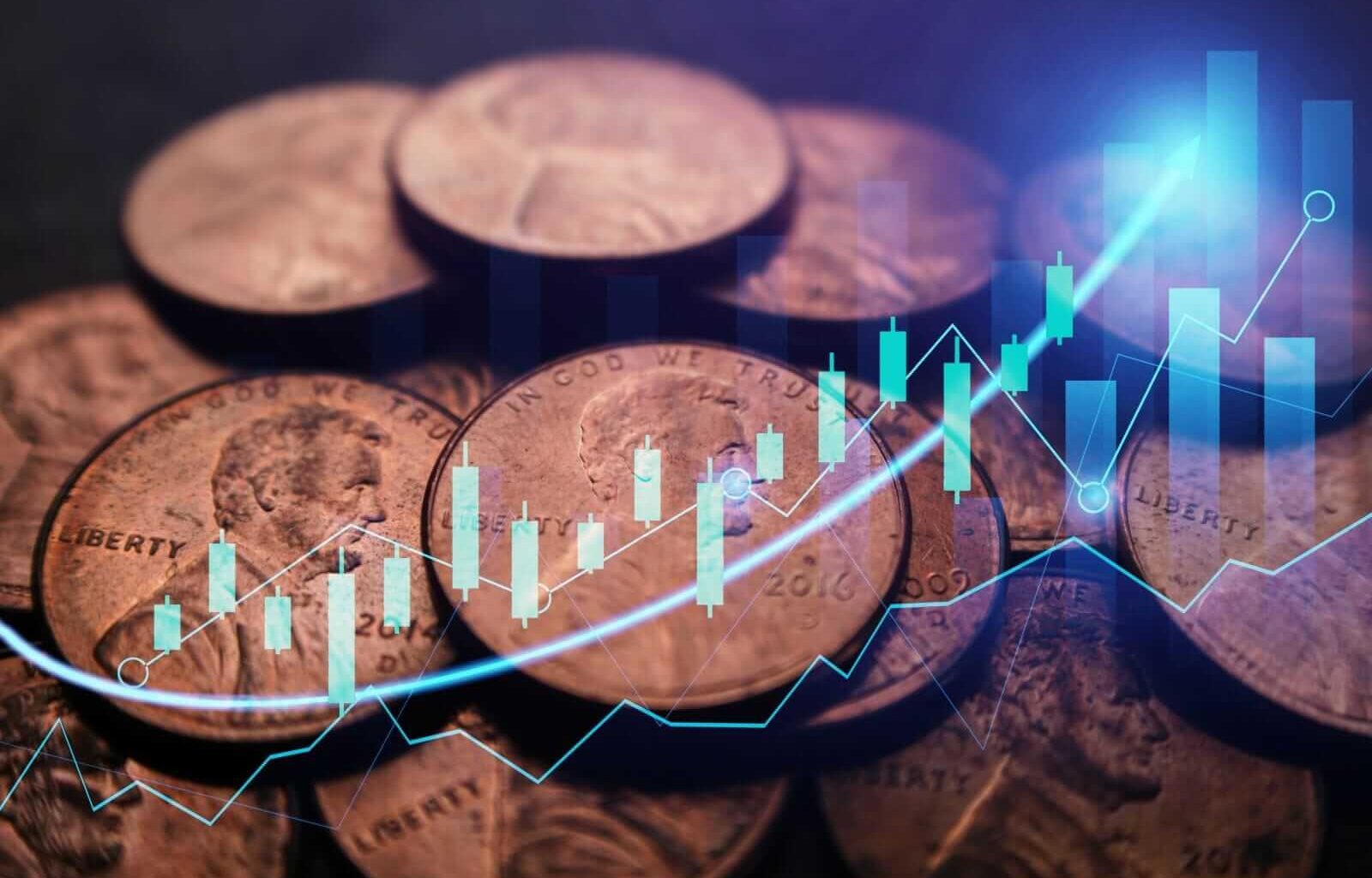 A pile of pennies with a trading chart superimposed_ Image by Shutterstock Professional via Shutterstock_