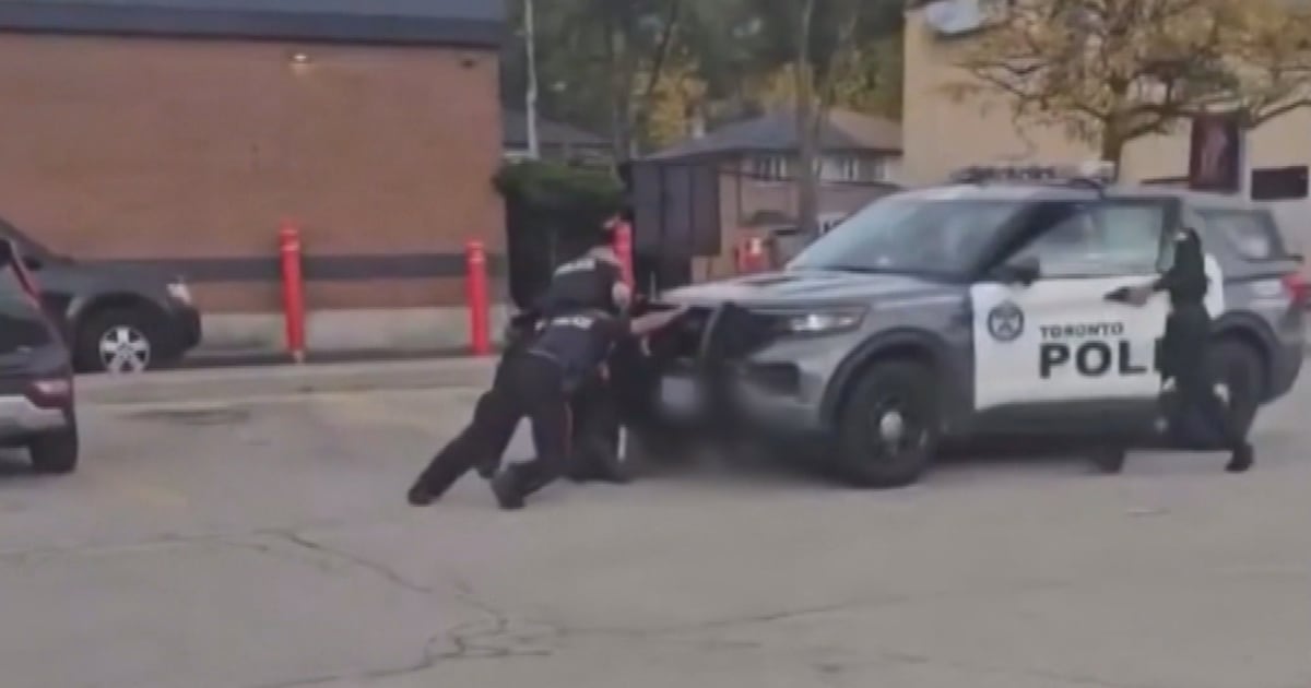 Video shows Toronto police cruiser running over suspect, officer during arrest - CTV News
