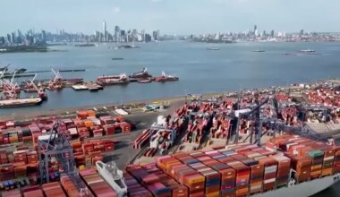 A busy shipping port with containers and cargo ships, reflecting global trade activity amidst U.S.-China trade tensions