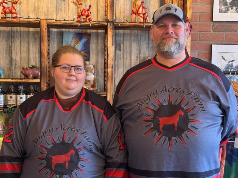 father and daughter standing in front of a shelf of soaps and lotions