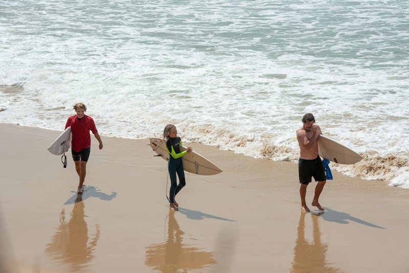 Coffs Soul Surfest participants walk along the beach near Coffs Harbour, Australia, during the 3-day faith-focused surf competition, Sept. 26-29, 2025.