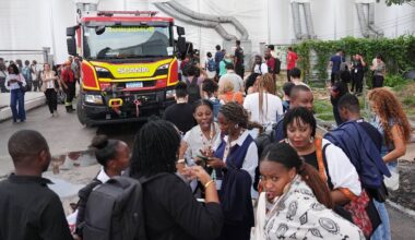 Attendees evacuate after a fire was reported inside the venue for the COP30 U.N. Climate Summit, Thursday, Nov. 20, 2025, in Belem, Brazil. (AP Photo/Joshua A. Bickel)
