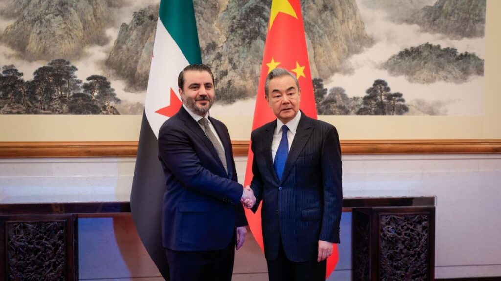 Syrian Foreign Minister Asaad al-Shibani shakes hands with his Chinese counterpart Wang Yi in the Chinese capital Beijing, 17 November 2025 (Syrian Ministry of Foreign Affairs and Expatriates, X)