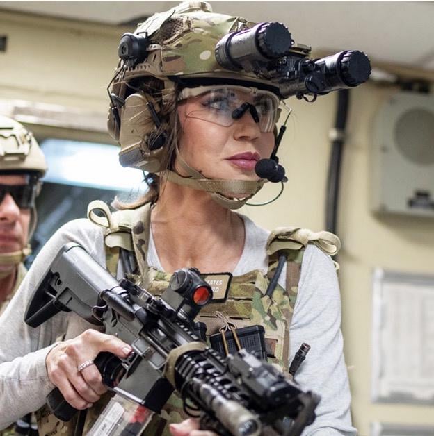 Kristi Noem trying to convince her dog to take a walk.