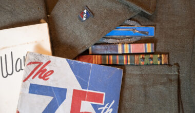 World War II veteran Vernon Brantley's military ribbons and Combat Infantryman Badge on his old uniform.
