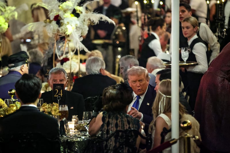 PALM BEACH, FLORIDA - OCTOBER 31: US President Donald Trump talks with guests during a Halloween party at his Mar-a-Lago estate on October 31, 2025 at Palm Beach, Florida. Trump is spending the weekend at his Mar-A-Lago estate in Palm Beach, Florida. (Photo by Samuel Corum/Getty Images)