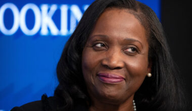 FILE - Lisa Cook, a Federal Reserve Board of Governors member, reacts during an event at the Brooki...