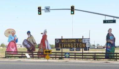 A welcome sign at a road intersection in Livingston, California.