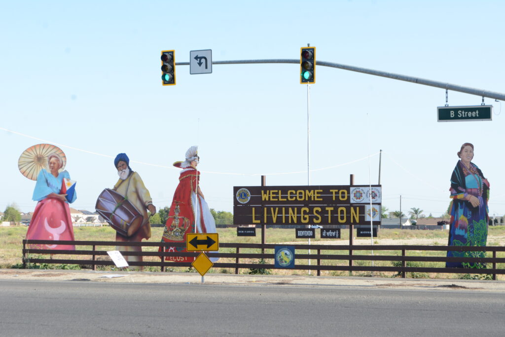 A welcome sign at a road intersection in Livingston, California.