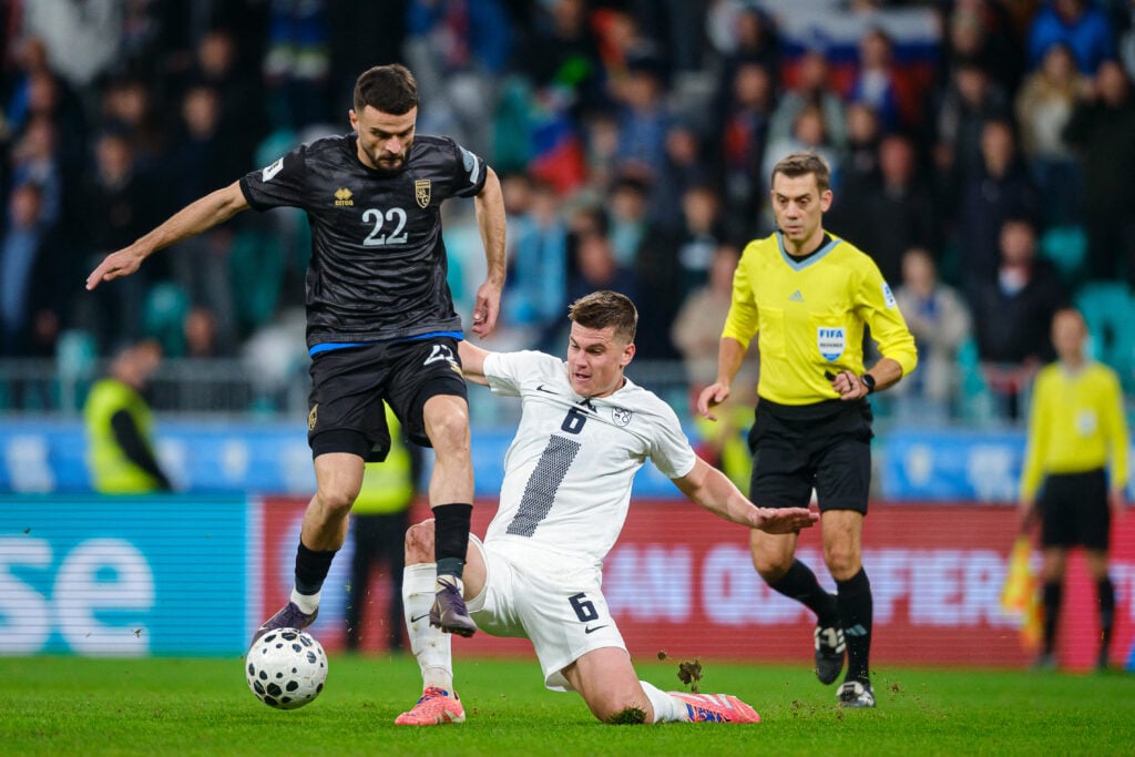 Jaka Bijol makes a tackle for Slovenia