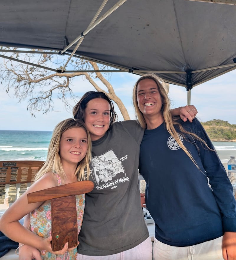 Winners of the open ladies division of the 2025 Coffs Soul Surfest smile with a trophy in Coffs Harbour, Australia, September 2025.