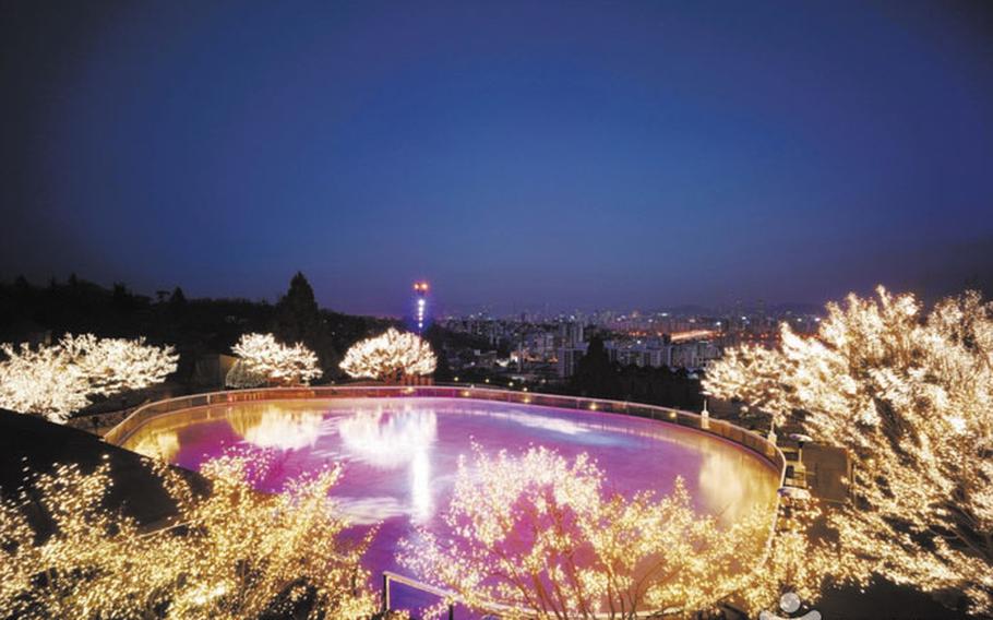 Illuminated trees and ice skating rinks at Grand Hyatt Hotel.