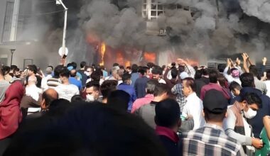 A widely recognized image from the November 2019 uprising showing a bank in flames near Tehran, Iran