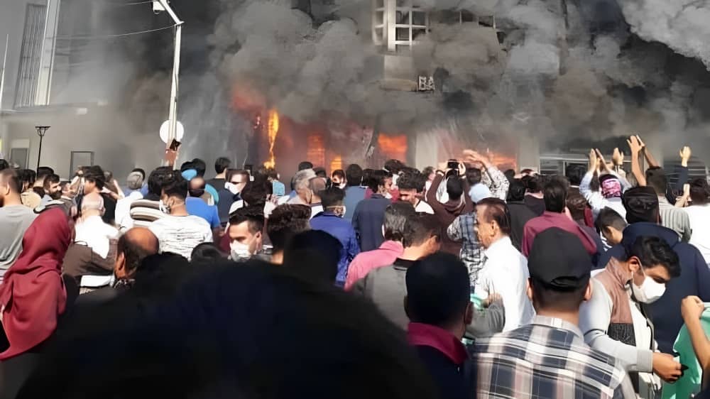 A widely recognized image from the November 2019 uprising showing a bank in flames near Tehran, Iran