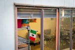 A Mexican flag hangs in the Arcoíris Cultural office on Nov. 17, 2025, in Newport, Ore. Arcoíris Cultural aims to support the Latine and Indigenous Mesoamerican community in the area, some of whom recently immigrated from Guatemala, through healthcare, civil and immigration rights, and food assistance programs.