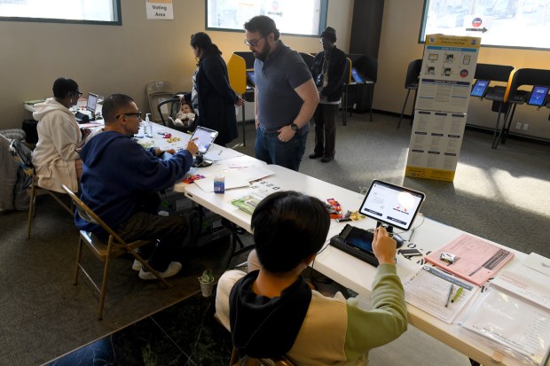 Voters fills out their ballots at the Millennium Biltmore Tower...
