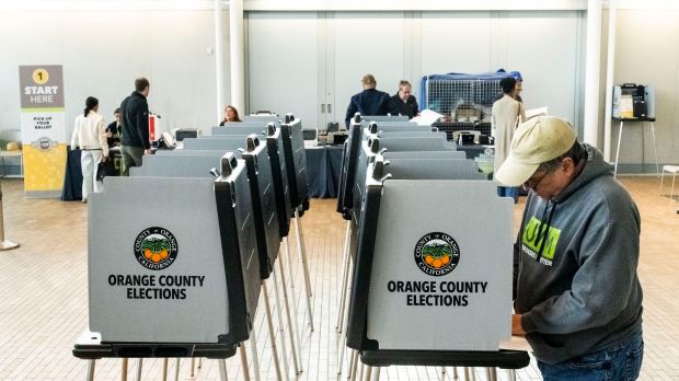 Voters cast their ballots on Proposition 50 at the Newport...