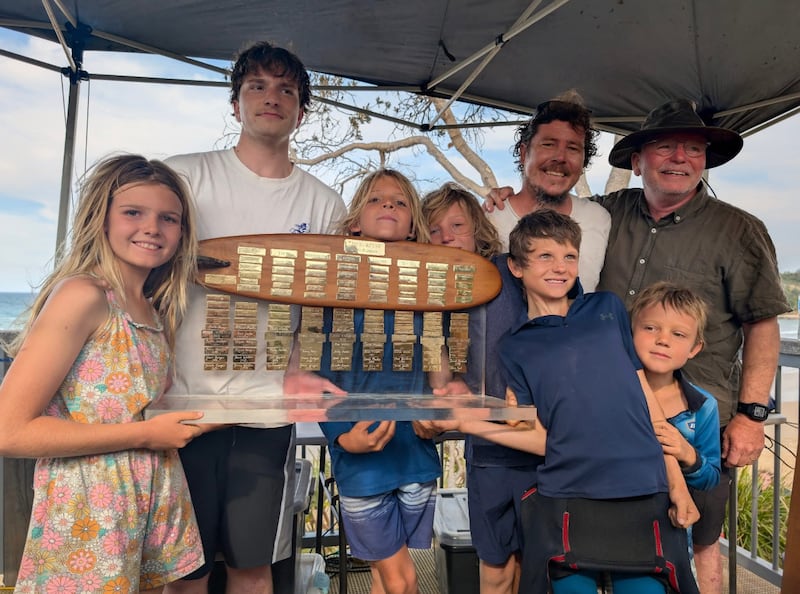 Coffs Soul Surfest participants smile with a trophy during the 2025 Surfest in Coffs Harbour, Australia, September 2025.