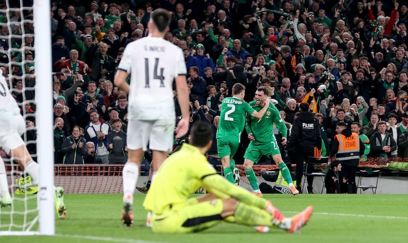 Ireland's Troy Parrott celebrates with Séamus Coleman after scoring his side's second goal against Portugal. Photograph: Nick Elliott/Inpho