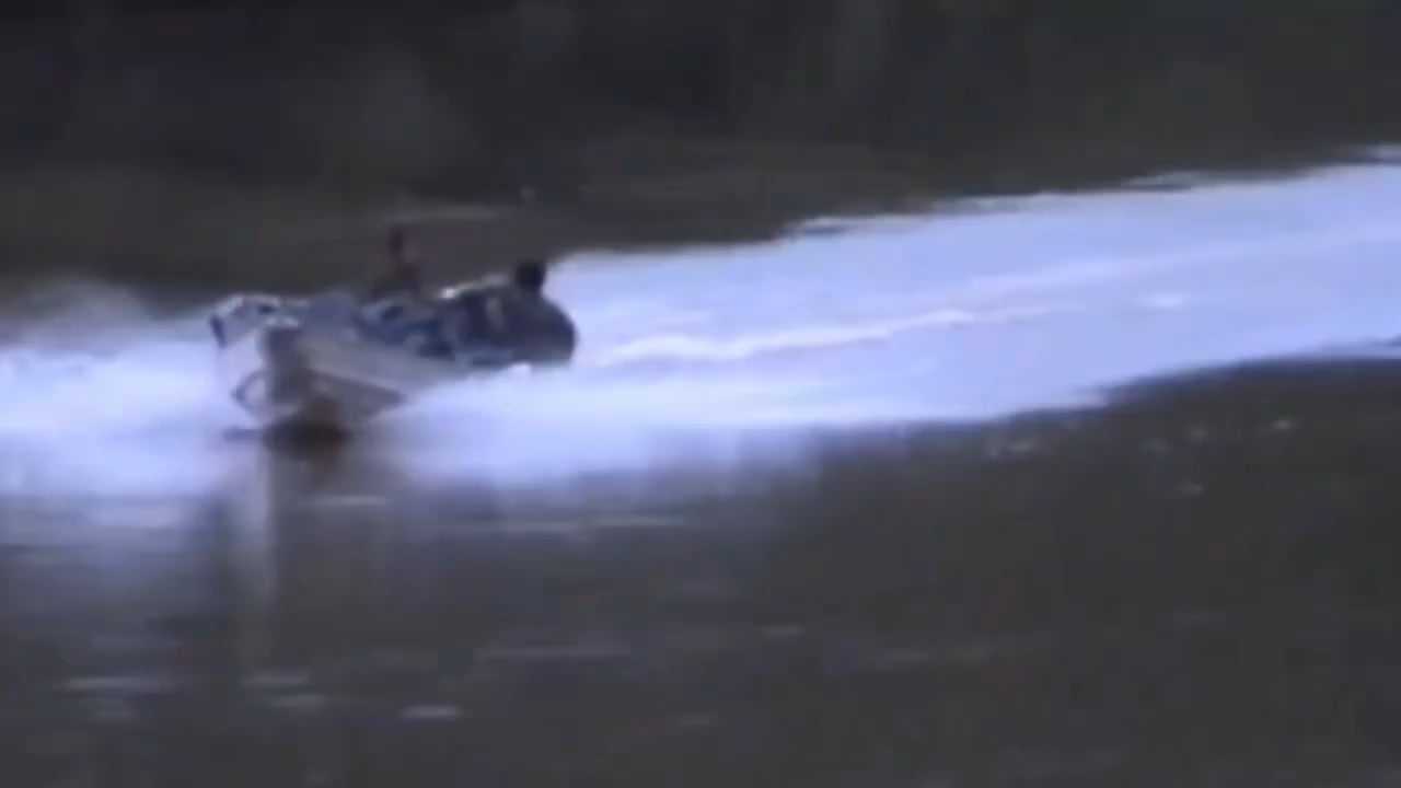 Special Forces of the National Army of Colombia ambushing FARC guerrillas navigating a river by boat. Circa 2005.