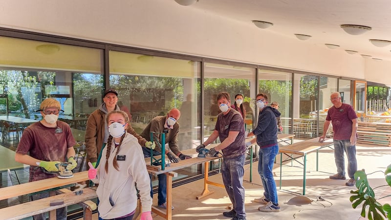 Missionaries from the Adriatic North Mission sand boards for new benches at the Debeli Rtič Health Resort on the Adriatic Sea in Slovenia on Friday, Nov. 7, 2025.