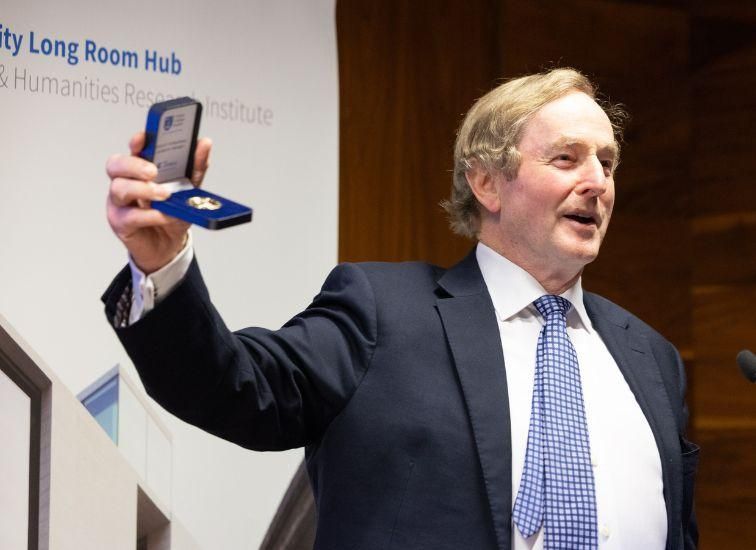 Picture of Enda Kenny holding gold medal in a box