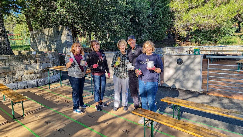 Missionaries from the Adriatic North Mission seal new benches at the Debeli Rtič Health Resort on the Adriatic Sea in Slovenia on Friday, Nov. 7, 2025.