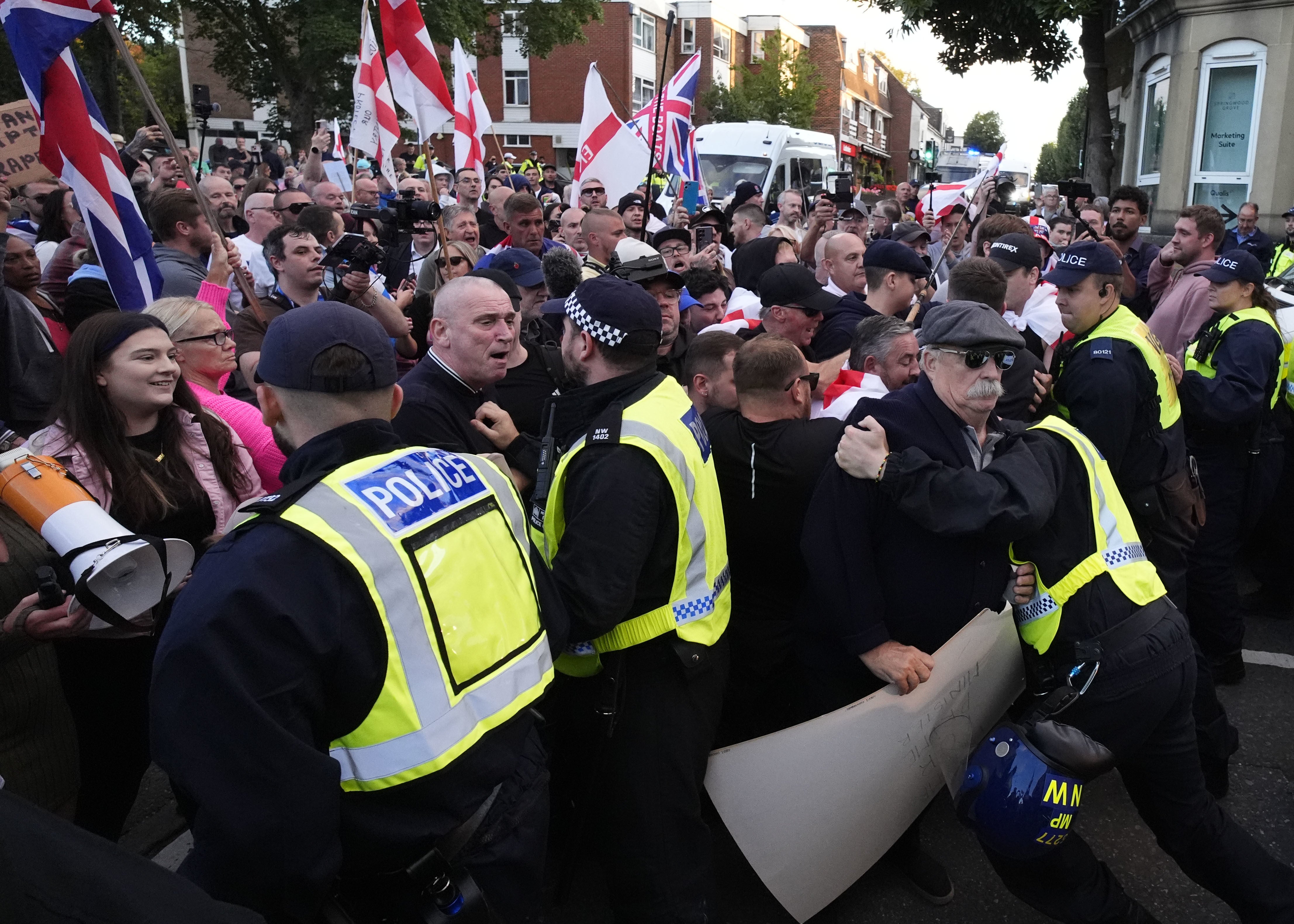 Demonstrators protest in Epping to stop a police van leaving after a protester was detained after hanging a Union flag from the civic offices earlier this year