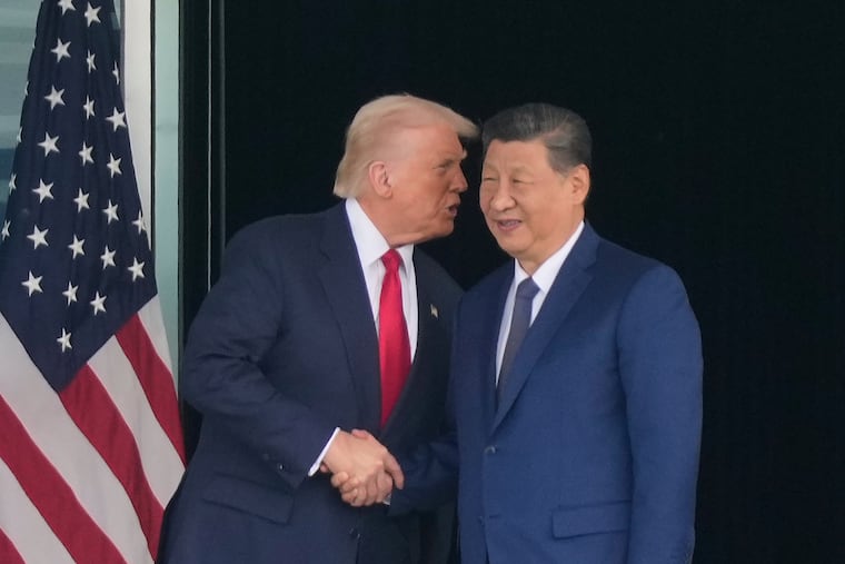 President Donald Trump and Chinese President Xi Jinping shake hands after their U.S.-China summit meeting, at Gimhae International Airport in Busan, South Korea, on Thursday.