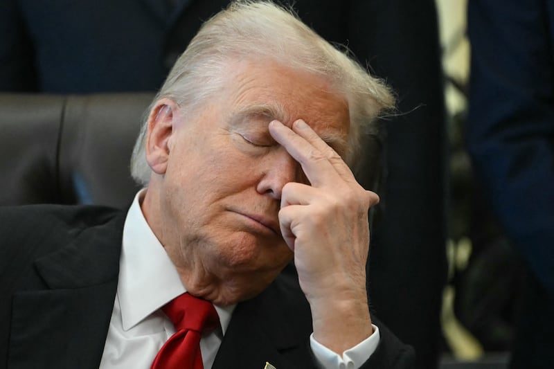 US President Donald Trump gestures as Secretary of Health and Human Services Robert F. Kennedy Jr. speaks during an event about weight-loss drugs in the Oval Office of the White House in Washington, DC on November 6, 2025.