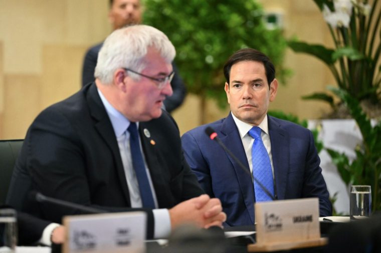 US Secretary of State Marco Rubio, right, listens as Ukraine's Foreign Minister Andriy Sybiga speaks during a G7 Session on Ukraine and Defense Cooperation during the G7 Foreign Ministers Meeting at the White Oaks Resort in Niagara-on-the-Lake, Canada, Wednesday, Nov. 12, 2025. (Mandel Ngan/Pool Photo via AP)