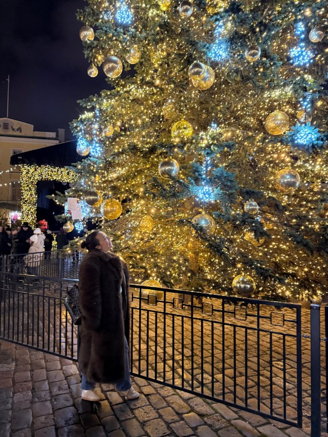 Metro writer Josie Copson stood in front of the giant Christmas tree in Tallinn Christmas markets