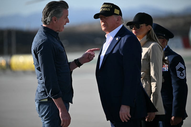 Donald Trump and First Lady Melania Trump are greeted by California Governor Gavin Newsom upon arrival at Los Angeles International Airport in Los Angeles, California, on January 24, 2025.